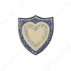 Back view of original US XXIV Corps patch showing raw embroidered stitching and khaki twill backing