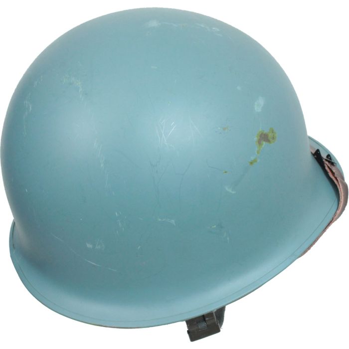 Top angle view of United Nations M1 helmet showing light blue paint and steel shell