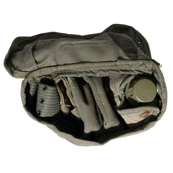 Overhead view inside the Greek M56 canvas field pack showing various webbing components packed inside