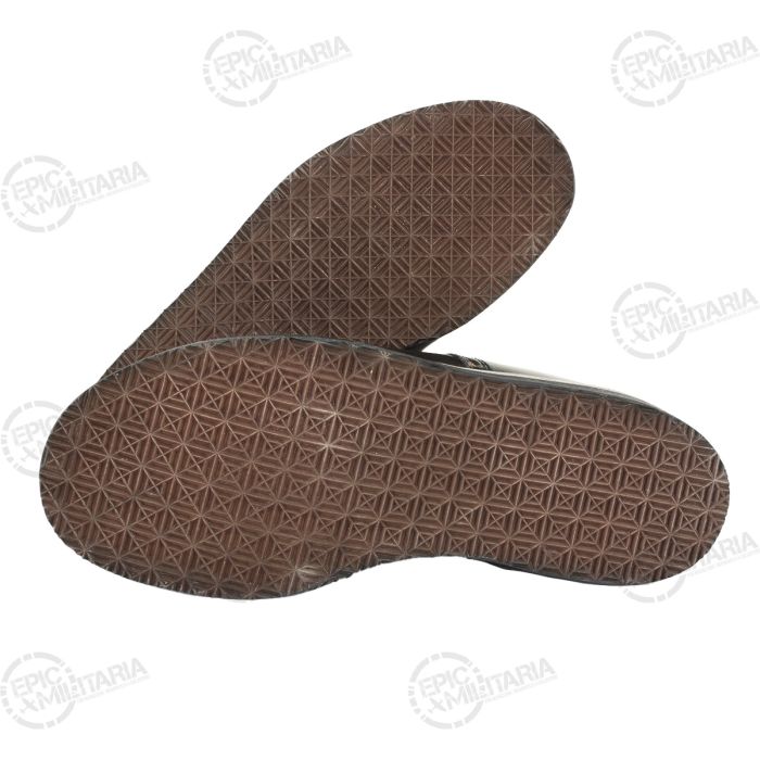 Underside view of pair of German winter pilot boots showcasing anti-slip rubber tread soles