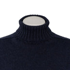 Close-up of thick ribbed turtleneck collar on navy blue British wool jumper