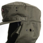 Close-up side view of Austrian winter cap showing ear flap hearing port opening and metal ventilation eyelets