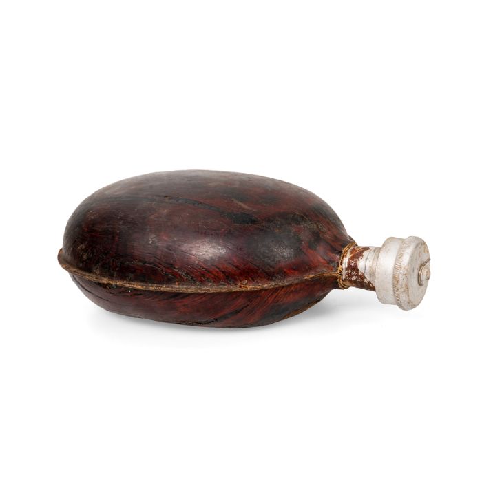 Side view of WW2 Bulgarian Army coconut canteen showing side seam and rear belt clip