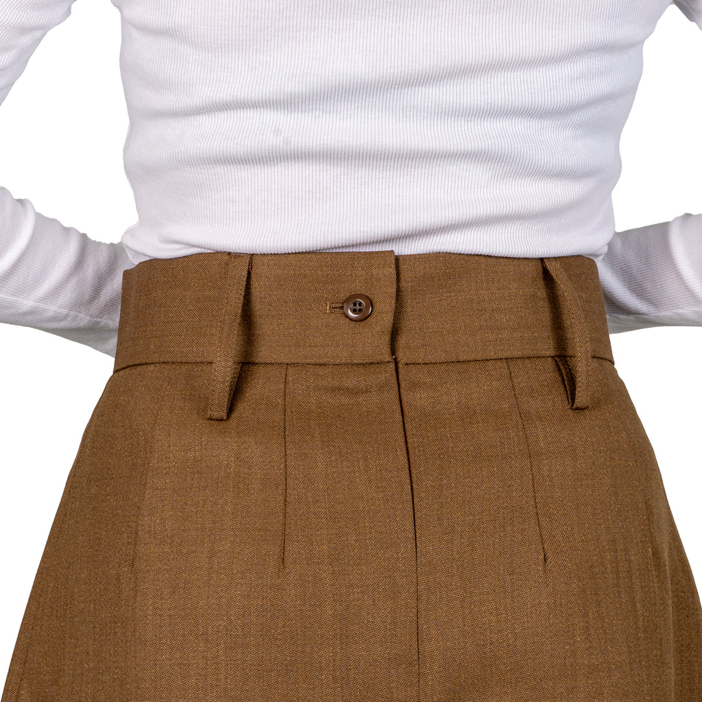 Rear close-up of the high waistband on the Barrack Dress Skirt, featuring a functional button and belt loops worn by a model.