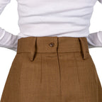 Rear close-up of the high waistband on the Barrack Dress Skirt, featuring a functional button and belt loops worn by a model.