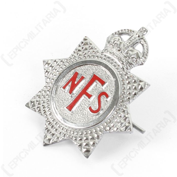 Angled front view of National Fire Service eight-pointed star cap badge showing pebbled texture