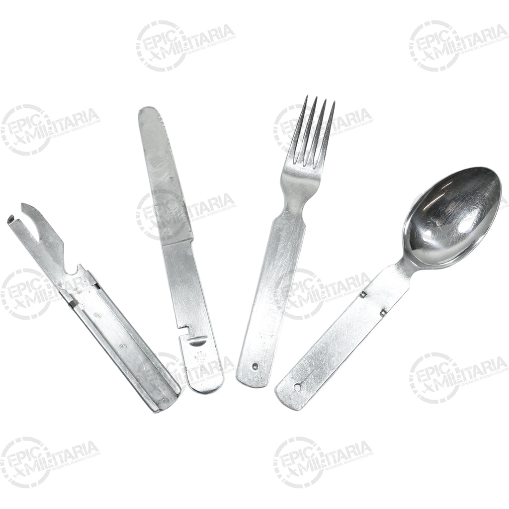 Authentic military surplus German Army mess kit cutlery set spread out, featuring durable stainless steel construction.