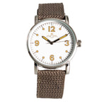1940s Canadian RCAF pilot watch featuring a 33mm case, white dial with gold-tone numerals, winged crest, and brown canvas strap.