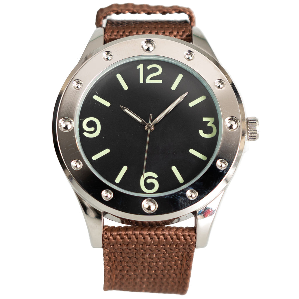 Front view of Eaglemoss Egyptian Naval Commando watch with black dial, pale green indices, and riveted bezel on a brown canvas strap.