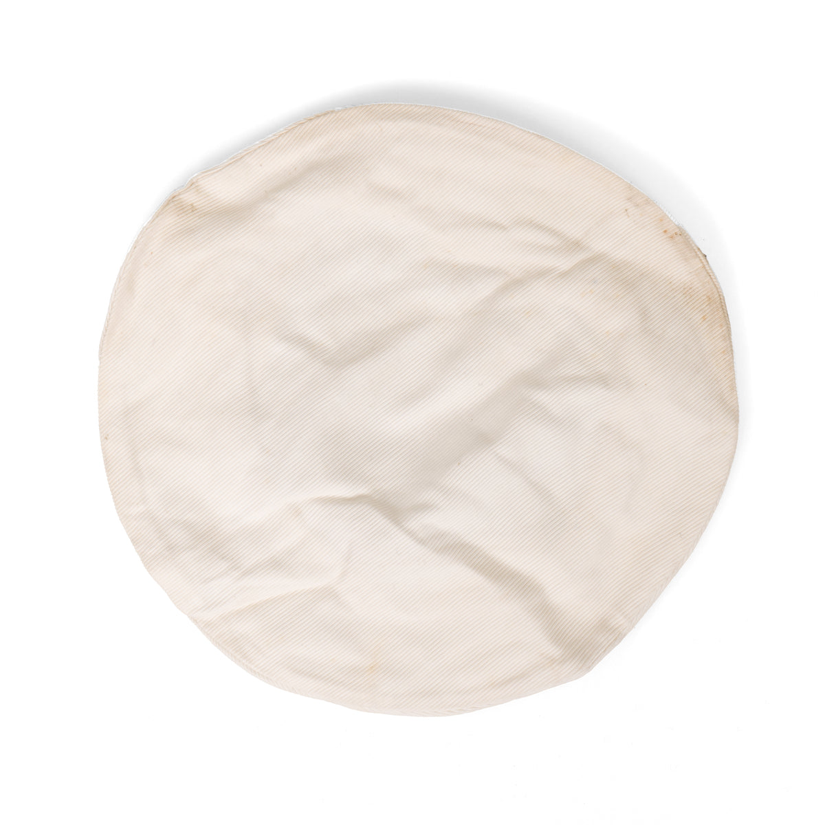 Top-down view of a circular, white cotton British Royal Navy cap topper showing its textured fabric and post-WW2 vintage condition.