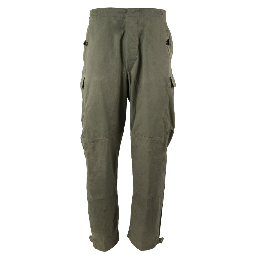 Original East German NVA field trousers in olive green, showing full-length view with cargo pockets and adjustable cuffs.