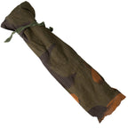 Rolled-up camouflage fabric on a white background