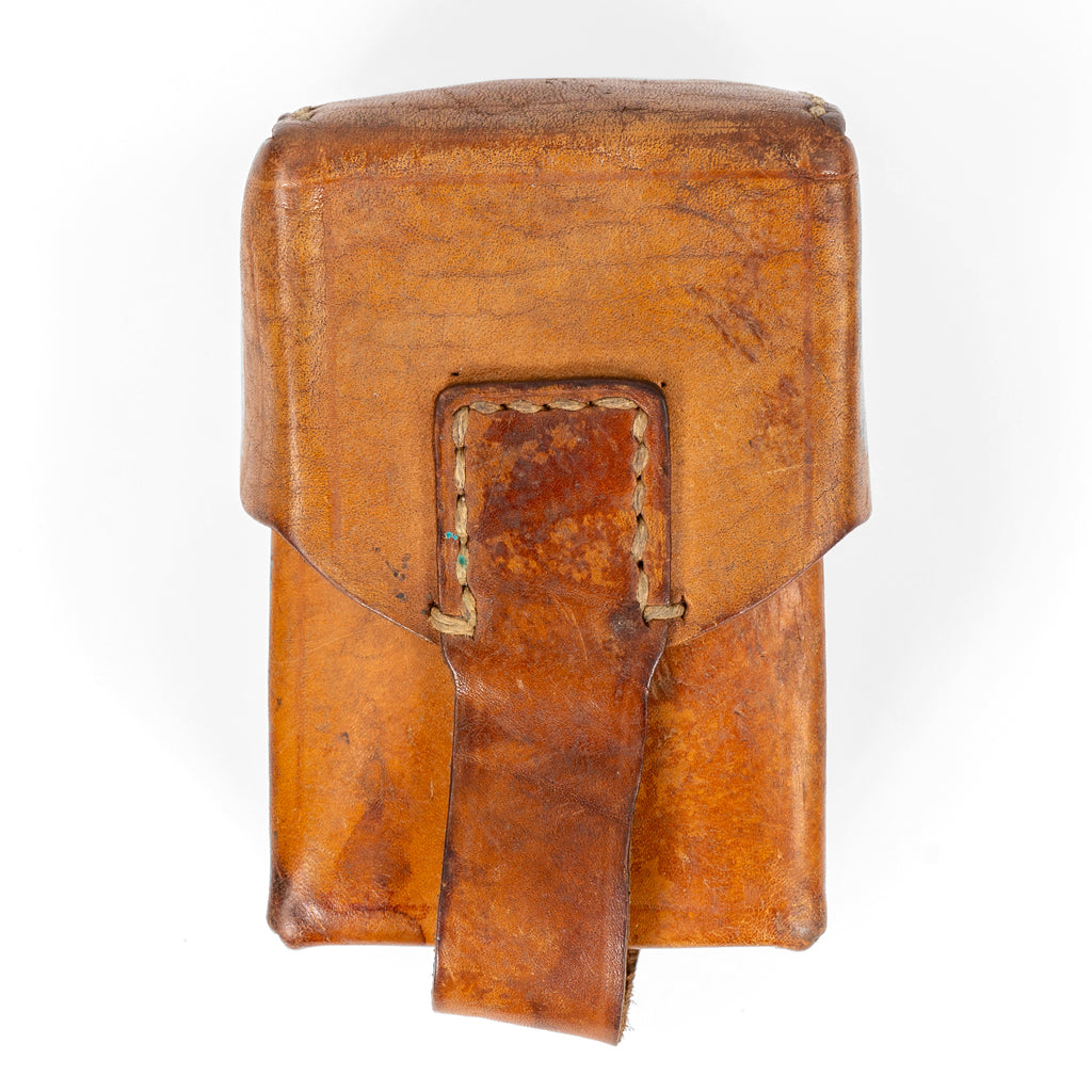 Original Serbian Army brown leather magazine pouch featuring a secure stitched strap and durable hard leather construction.