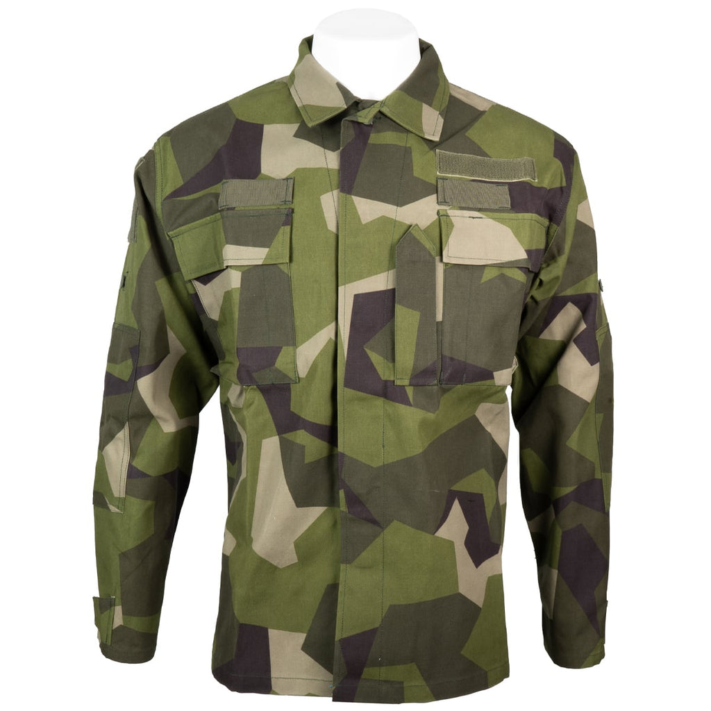 Authentic Swedish M90 field shirt in geometric camo pattern with two chest pockets and hook and loop patches.