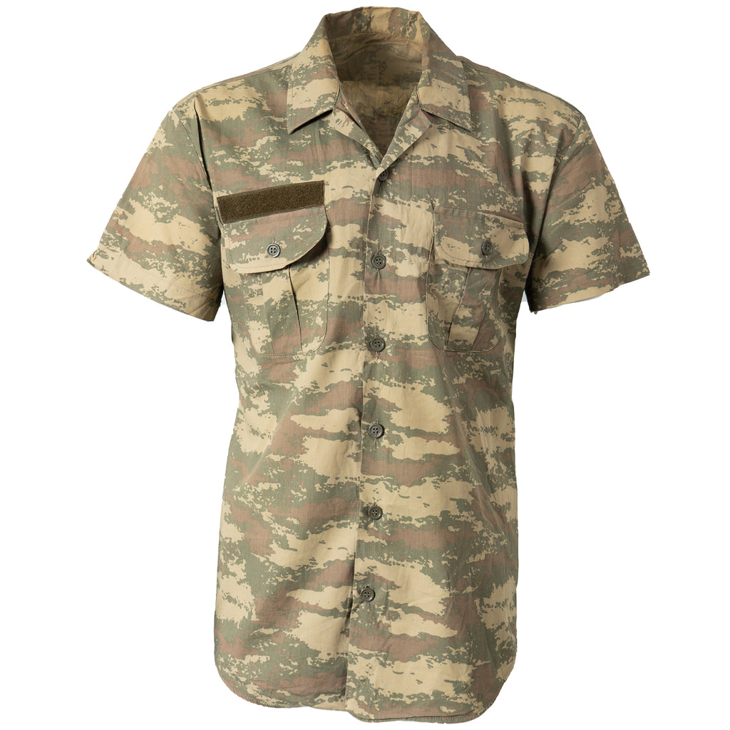 Original Turkish Army short-sleeve field shirt featuring a scrubland camouflage pattern, button-down front, and dual chest pockets with green Velcro strip.