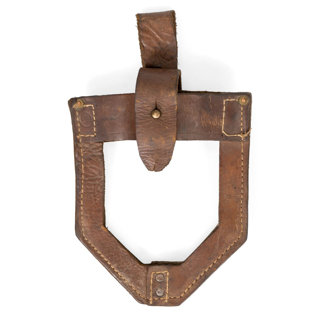 Front detail of a brown leather JNA shovel cover displaying authentic military surplus wear, brass hardware, and reinforced leather edge stitching.