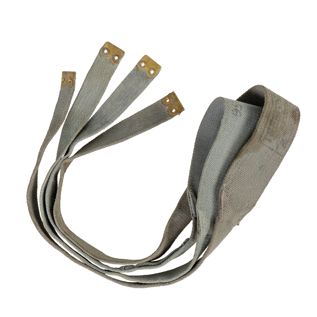Grey-toned original British 37 Pattern cross straps with brass hardware, showing historical service wear.