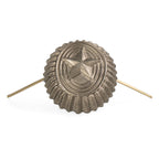 Metallic star-shaped object with ribbed texture on a white background