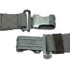 Close-up detail of two metallic spring-loaded clips on an authentic East German RPG7 surplus sling showing the grey steel finish.