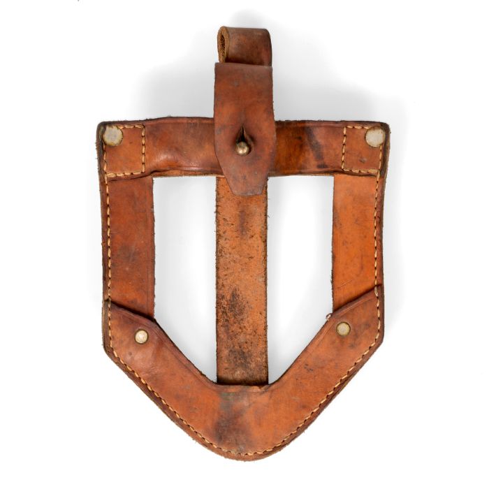 Front view of original brown Yugoslavian JNA leather shovel cover with brass stud strap