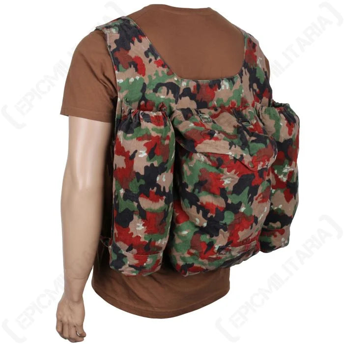 Side view showing the right profile of the original Swiss M70 camo rucksack made from heavy cotton canvas.