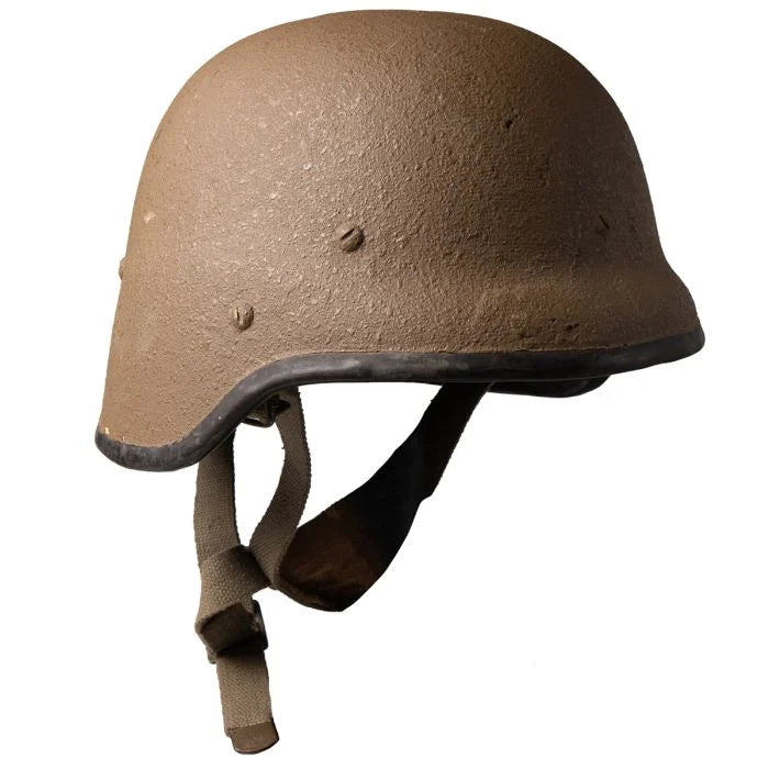 Three-quarter view showing textured shell and side bolts of M87 helmet
