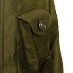 Close-up of the angled chest pocket on the Canadian combat jacket showing the slotted tape Canadian button and sateen fabric.
