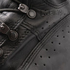 Detail of speed lacing eyelets and embossed Meindl brand logo on the waterproof leather upper