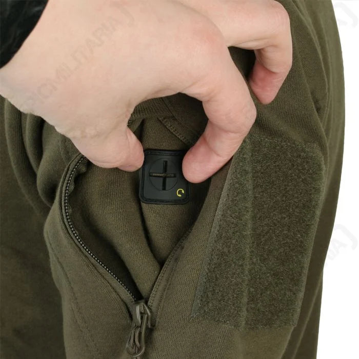 Internal macro close-up of rubberised headphone cable port inside sleeve pocket