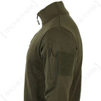 Close-up detail of upper arm zipped pocket with fabric zipper pull and loop patch field