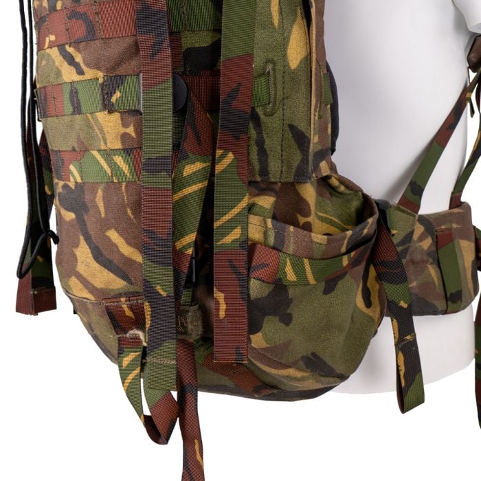 Side detail showing the side zipper for attaching side pouches, compression straps, and lower utility pocket.