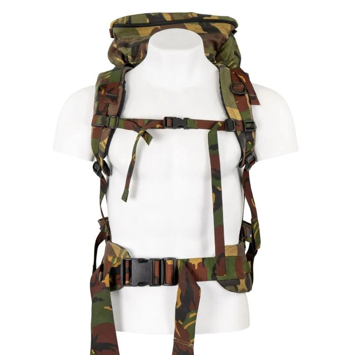 Padded shoulder straps, sternum strap, and adjustable hip belt with plastic quick-release buckle on a mannequin.