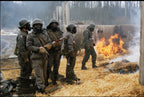 Historical archival scene showing Danish Civil Defence personnel in field training exercises wearing their iconic grey-green M71 parkas.
