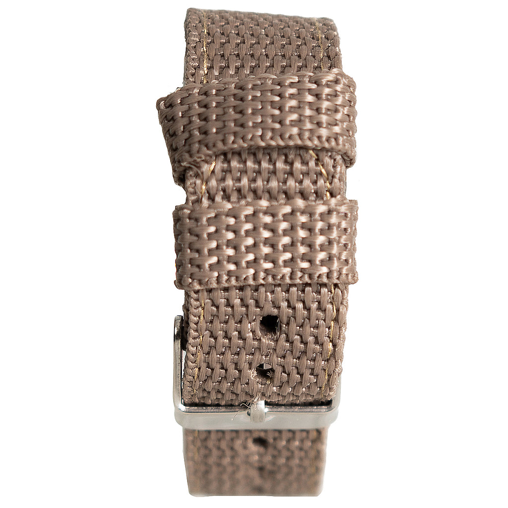 Detailed close-up of the durable brown woven canvas watch strap, showing its textured fabric and metal buckle closure.