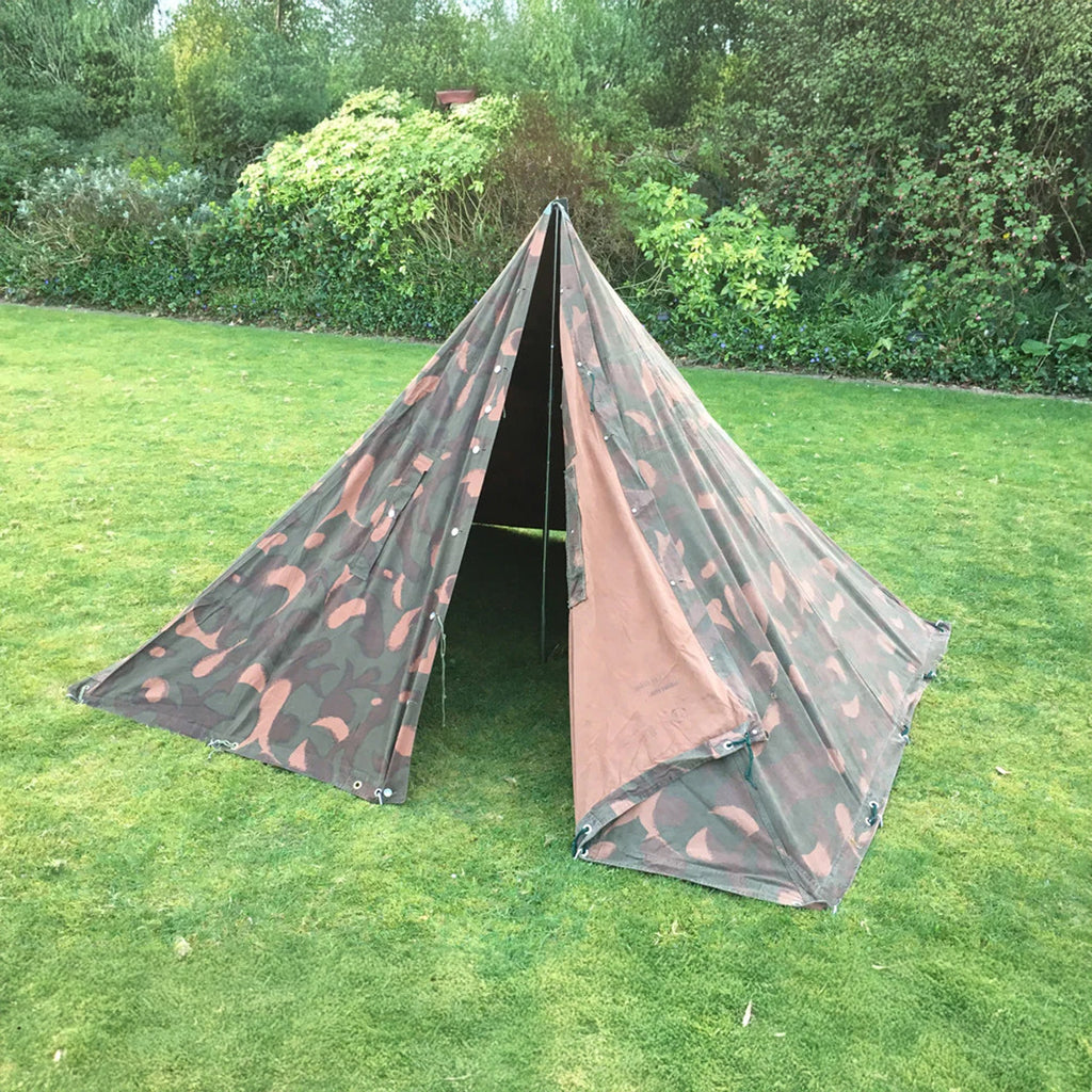Hungarian Army M82 Zeltbahn two-person A-frame tent set up in a garden with woodland camo.