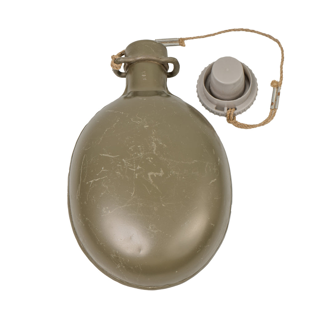 Single Czech M60 aluminium military water bottle in olive drab with a tethered grey plastic cap.