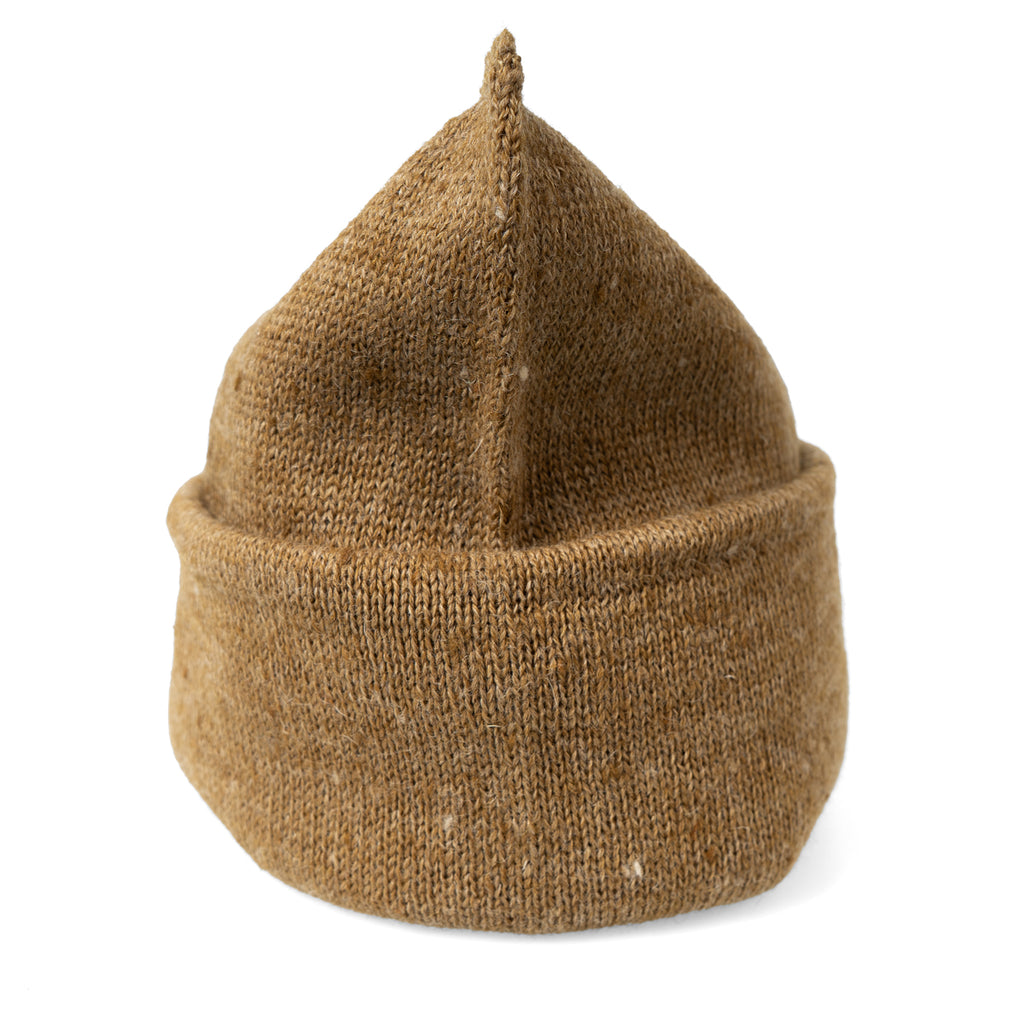 A single brown woollen tube folded into a beanie shape, showing its seamless military-style construction.