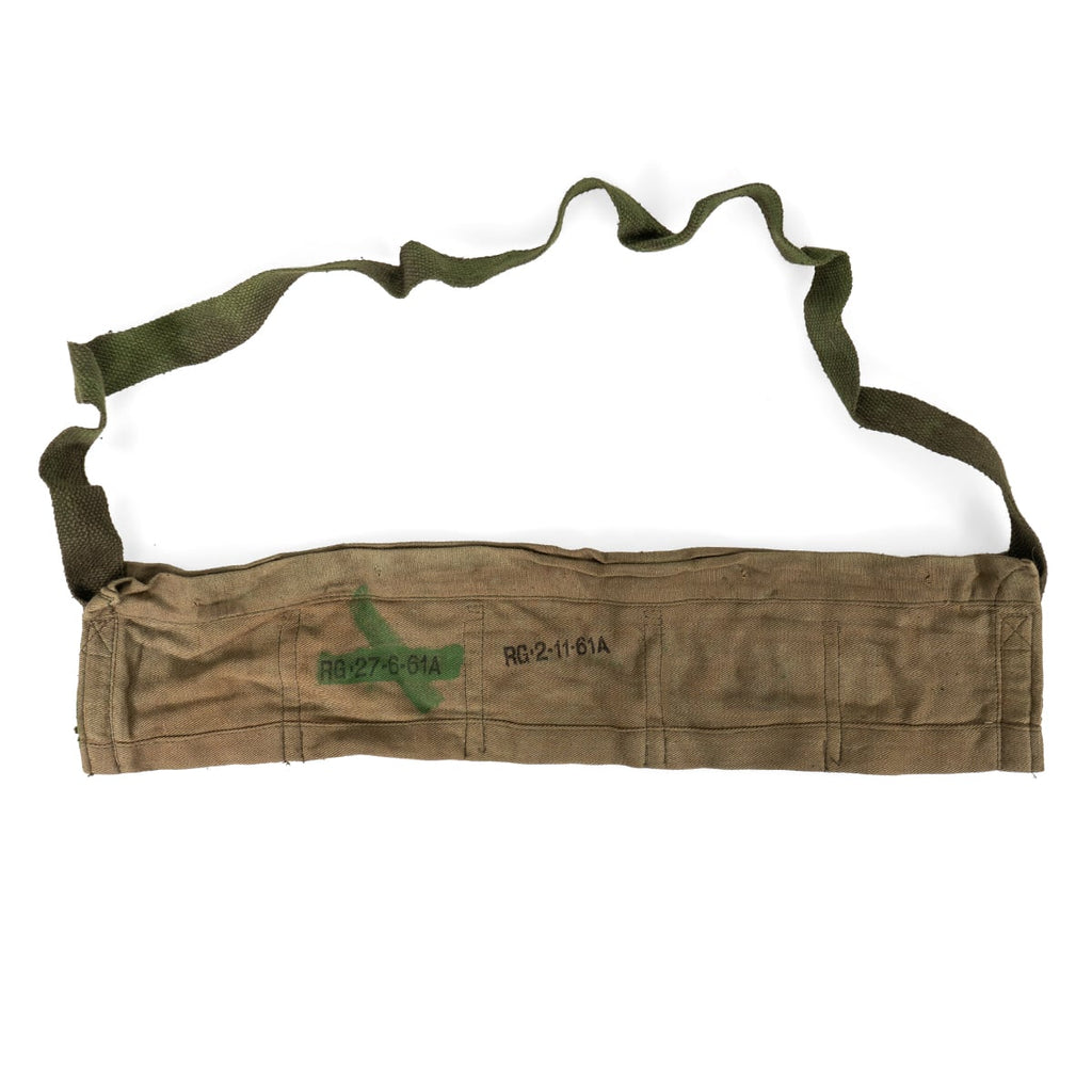 Close-up of a 1961 dated British Army bandolier featuring a green cross marking and distinct cotton weave detail.