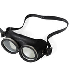 Vintage German Army surplus goggles featuring a durable rubberised frame, clear lenses, and head strap from a high-angle perspective.