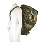 Mannequin profile view showing the adjustable shoulder strap and wear of the waterproof vinyl army pack.