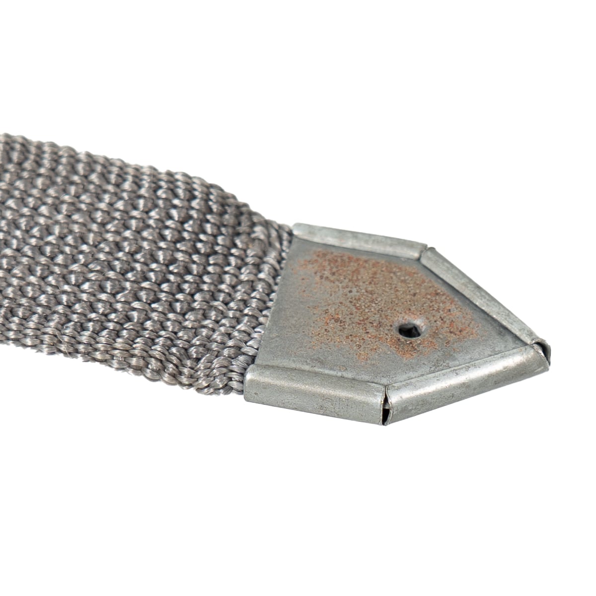 Detail of the pointed metal end tip on an original NVA Rödelriemen strap, showing authentic cold war field-used condition.
