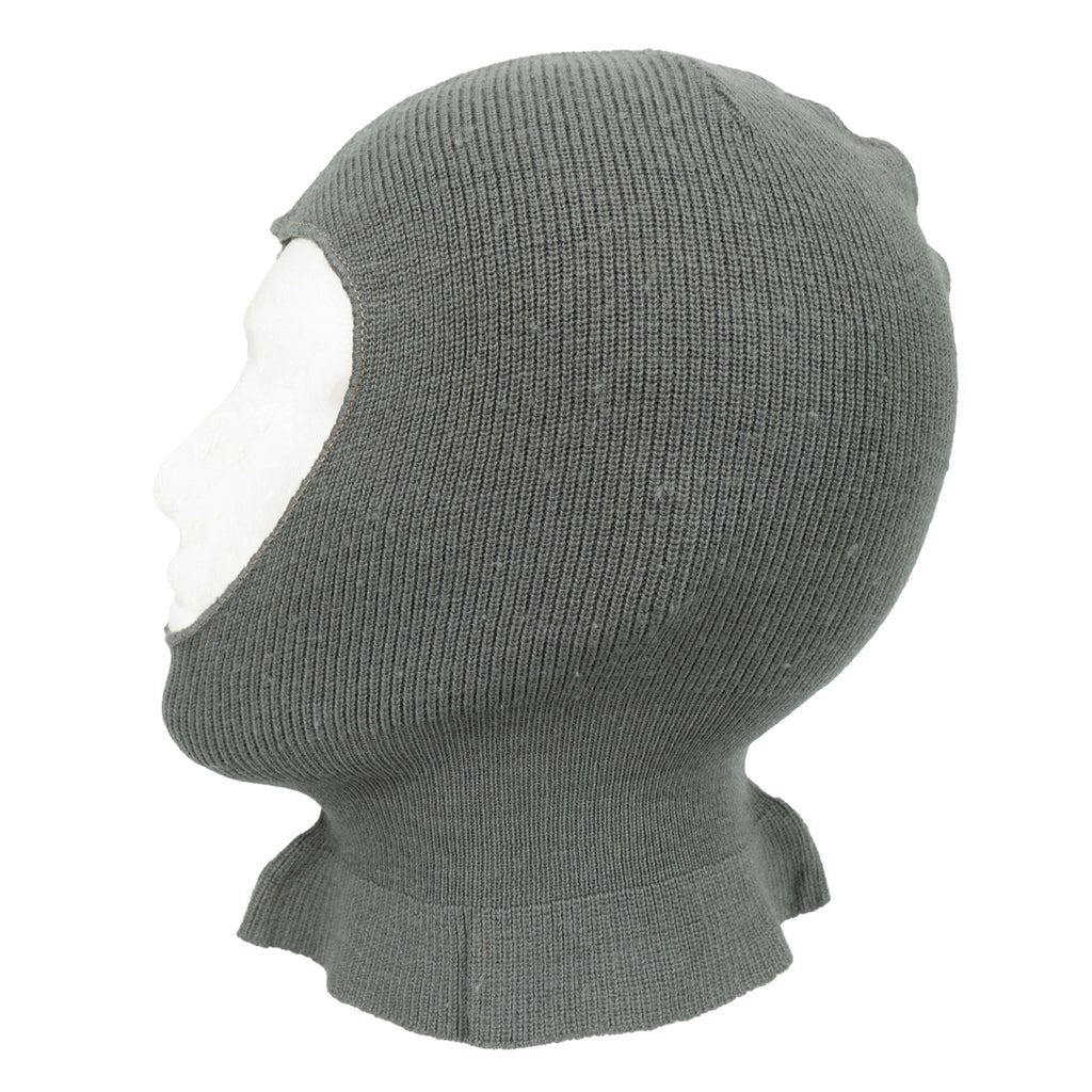 Side view of a vintage Swiss military wool balaclava on a mannequin head, highlighting the thick knit and protective neck design.