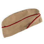Single original WW2 US Army Khaki Garrison Cap with red piping, viewed from a side angle.