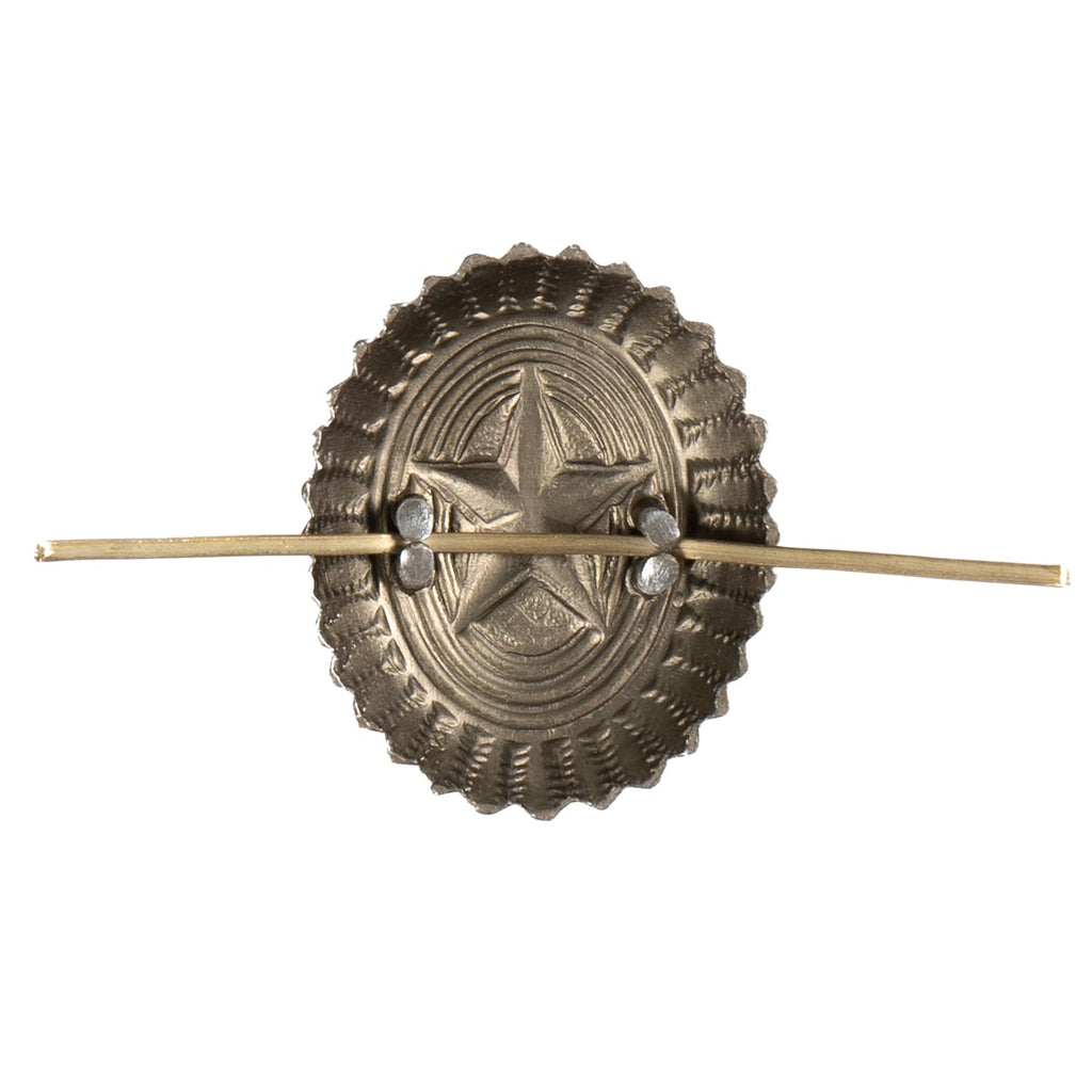 Decorative metal hairpin with star design on a white background