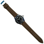 Overhead full view of the Commando military wrist watch laid flat with brown webbing band