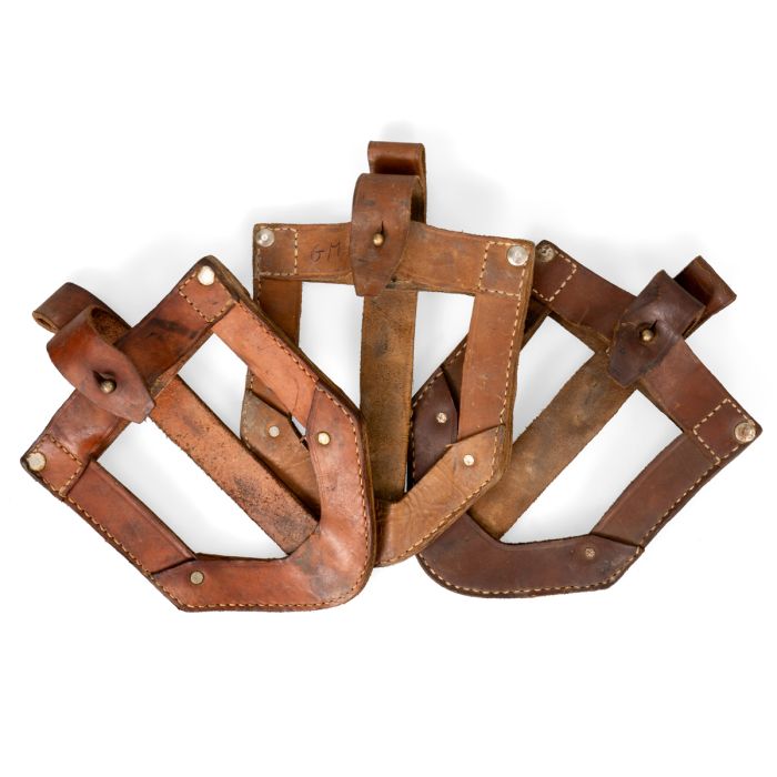 Group of original Yugoslavian JNA leather shovel covers showing natural leather tone variations