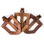 Group of original Yugoslavian JNA leather shovel covers showing natural leather tone variations