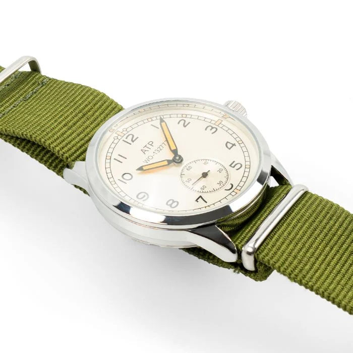 Angled view of the silver-white dial, sub-seconds register, and domed crystal of the British ATP Service Watch