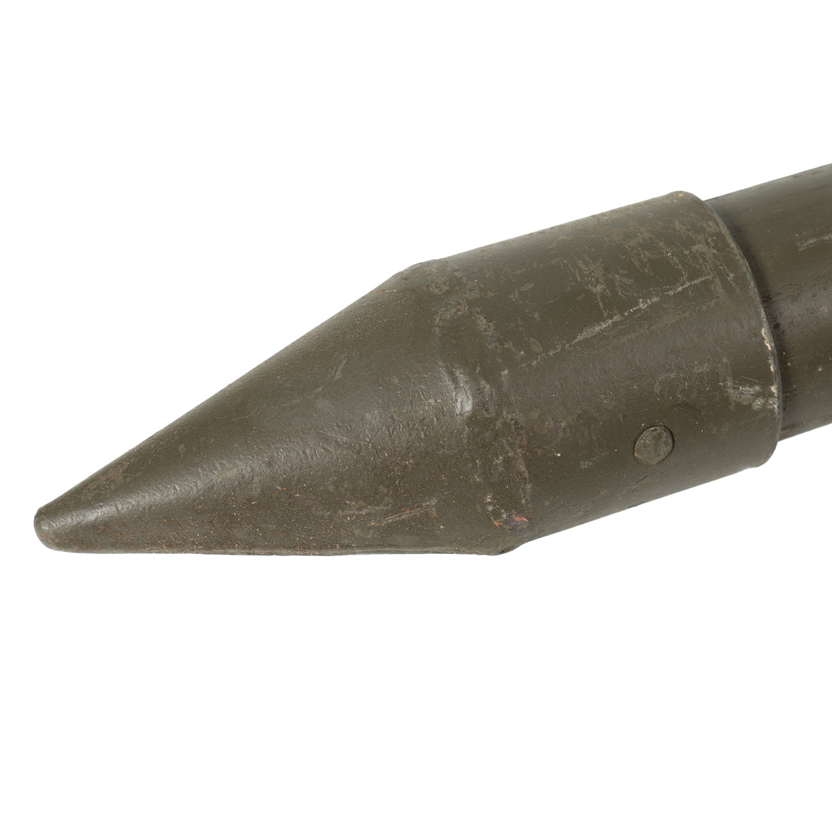 Detail view of the heavy-duty conical steel point on an ash wood German military tent peg designed for rocky soil.