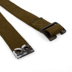 Detailed view of the military-grade olive drab cotton canvas strap, focusing on the sturdy construction and metallic hardware fixtures.